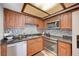 Modern kitchen features stainless steel appliances, granite counters, and stylish backsplash at 7952 Diamond Rock Way # 102, Las Vegas, NV 89128