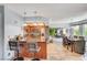 Bright kitchen showcases stainless steel appliances, breakfast bar, and adjacent dining area at 7952 Diamond Rock Way # 102, Las Vegas, NV 89128