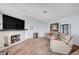Cozy living room featuring a stone fireplace and comfortable seating at 7952 Diamond Rock Way # 102, Las Vegas, NV 89128