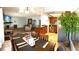 Panoramic view showcasing the kitchen, dining area, and cozy living room with a fireplace at 7952 Diamond Rock Way # 102, Las Vegas, NV 89128
