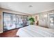 Inviting main bedroom with wood floors, closet, and a view to the bathroom at 7952 Diamond Rock Way # 102, Las Vegas, NV 89128