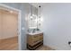 This bathroom features modern vanity, stylish lighting, and contemporary fixtures against neutral wall at 81 Alerion St, Las Vegas, NV 89138