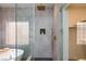 Stylish shower with gold hardware, herringbone tile and glass enclosure at 81 Alerion St, Las Vegas, NV 89138