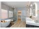 Modern bathroom featuring double vanity, freestanding tub, glass shower and decorative fixtures at 81 Alerion St, Las Vegas, NV 89138