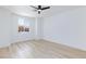Unfurnished bedroom with wood floors, ceiling fan and ample natural light at 81 Alerion St, Las Vegas, NV 89138