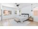 Relaxing bedroom with modern decor, wood flooring, neutral colors and lots of natural light at 81 Alerion St, Las Vegas, NV 89138