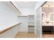 Walk-in closet with rod and shelf storage and wood floors at 81 Alerion St, Las Vegas, NV 89138