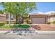 Charming single-story home featuring a well-manicured lawn and a two-car garage at 81 Alerion St, Las Vegas, NV 89138