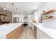 Bright modern kitchen with stainless steel appliances, marble countertops, and light wood flooring at 81 Alerion St, Las Vegas, NV 89138