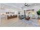 Open floor plan with a spacious living room, modern kitchen, and large windows offering backyard views at 81 Alerion St, Las Vegas, NV 89138