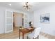 Stylish home office featuring french doors, wood floors, modern chandelier and neutral decor at 81 Alerion St, Las Vegas, NV 89138