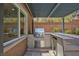 An outdoor kitchen features a stainless steel grill, countertop, and beverage cooler, perfect for outdoor entertaining at 81 Alerion St, Las Vegas, NV 89138