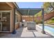 Outdoor kitchen featuring stainless steel grill, countertop, and shaded pergola at 81 Alerion St, Las Vegas, NV 89138