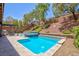 Backyard pool and spa area with a barbecue and a landscaped terraced garden at 81 Alerion St, Las Vegas, NV 89138