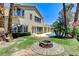 Expansive backyard featuring a patio, fire pit, and a glimpse of the sparkling pool at 8113 Gothic Ave, Las Vegas, NV 89117
