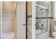 Well-lit bathroom featuring a tub and glass-enclosed shower at 8113 Gothic Ave, Las Vegas, NV 89117