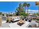 Staged rooftop deck showing furniture, potted plants, and mature landscaping at 8113 Gothic Ave, Las Vegas, NV 89117
