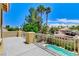 Outdoor deck with an overview of a swimming pool, mature landscaping and blue skies at 8113 Gothic Ave, Las Vegas, NV 89117