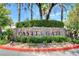 A landscaped brick sign marks the neighborhood entrance at 8113 Gothic Ave, Las Vegas, NV 89117