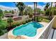 Inviting backyard oasis with a sparkling pool, spa, and lush landscaping at 8113 Gothic Ave, Las Vegas, NV 89117