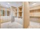 Large walk-in closet featuring carpeted floor, built-in shelving, and storage at 8113 Gothic Ave, Las Vegas, NV 89117