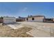 Home featuring a spacious backyard with a detached shed and fence at 813 E Bartlett Ave, North Las Vegas, NV 89030