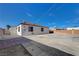 This home's backyard has a mix of concrete and brick with access gate at 813 E Bartlett Ave, North Las Vegas, NV 89030