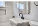 Updated bathroom with grey vanity, modern sink and fixtures, plus a window for natural light at 813 E Bartlett Ave, North Las Vegas, NV 89030