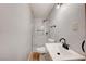 Modern bathroom featuring frameless shower, sleek sink and fixtures, and a floating vanity at 813 E Bartlett Ave, North Las Vegas, NV 89030