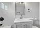 Clean bathroom design with grey vanity, modern sink and fixtures, and a white toilet at 813 E Bartlett Ave, North Las Vegas, NV 89030