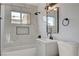 This bathroom has white marble look shower surround and matte black fixtures at 813 E Bartlett Ave, North Las Vegas, NV 89030