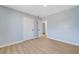 This bedroom features wood-look flooring, light blue walls, and a closet at 813 E Bartlett Ave, North Las Vegas, NV 89030
