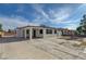 Exterior of property featuring an expansive driveway and low maintenance landscaping in the front at 813 E Bartlett Ave, North Las Vegas, NV 89030