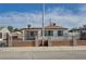 Charming single-story home featuring a secure gated perimeter and a well-maintained front yard at 813 E Bartlett Ave, North Las Vegas, NV 89030