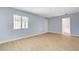Bright living room boasts new floors, neutral paint, and ample natural light from a large window at 813 E Bartlett Ave, North Las Vegas, NV 89030