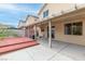 Inviting backyard with covered patio, wooden deck, offering great outdoor living space at 8221 Stoneheather Ct, Las Vegas, NV 89117