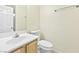 Bathroom features a single sink vanity with tile floors and a toilet at 8221 Stoneheather Ct, Las Vegas, NV 89117