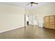 This bedroom offers natural light, hardwood floors, closet, neutral color scheme, and access to the bathroom at 8221 Stoneheather Ct, Las Vegas, NV 89117