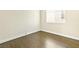 Bedroom features laminate flooring and a window at 8221 Stoneheather Ct, Las Vegas, NV 89117