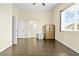 This bedroom offers natural light, hardwood floors, closet, neutral color scheme, and access to the bathroom at 8221 Stoneheather Ct, Las Vegas, NV 89117