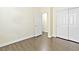 Bedroom with laminate flooring and bi-fold closet doors at 8221 Stoneheather Ct, Las Vegas, NV 89117