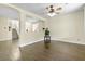 Spacious living room with open layout and stylish hardwood floors and neutral paint at 8221 Stoneheather Ct, Las Vegas, NV 89117