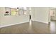 Open-concept living room with hardwood floors and ample natural light at 8221 Stoneheather Ct, Las Vegas, NV 89117