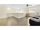 Living room features laminate flooring and multiple windows at 8221 Stoneheather Ct, Las Vegas, NV 89117