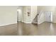 Bright living room with hardwood floors, staircase, and modern decor at 8221 Stoneheather Ct, Las Vegas, NV 89117