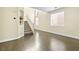 Inviting living room with hardwood floors, a staircase, and plenty of space at 8221 Stoneheather Ct, Las Vegas, NV 89117