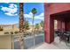 Inviting balcony with outdoor seating and view of street at 83 E Agate Ave # 207, Las Vegas, NV 89123