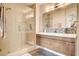 Stylish bathroom with dual sinks, modern vanity, and glass shower at 83 E Agate Ave # 207, Las Vegas, NV 89123