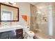 Contemporary bathroom with glass-enclosed shower, large mirror, and modern sink at 83 E Agate Ave # 207, Las Vegas, NV 89123