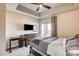 Bedroom with ceiling fan, dresser, desk, and a sliding door with a balcony at 83 E Agate Ave # 207, Las Vegas, NV 89123